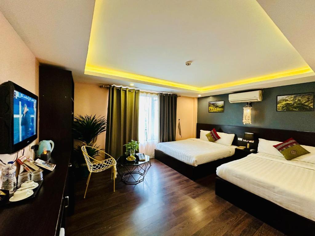 Postel nebo postele na pokoji v ubytování HeLLo Sapa Hotel