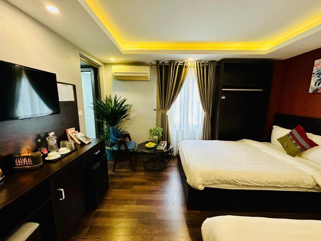 Postel nebo postele na pokoji v ubytování HeLLo Sapa Hotel