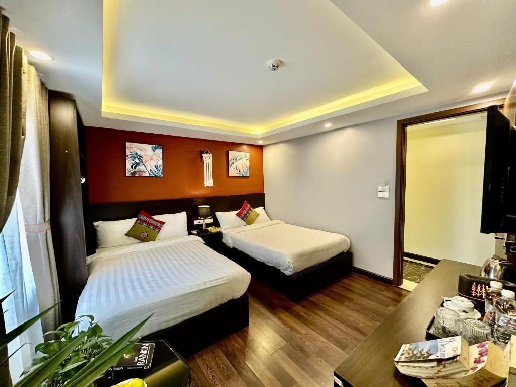 Postel nebo postele na pokoji v ubytování HeLLo Sapa Hotel