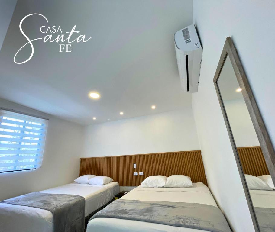 Postel nebo postele na pokoji v ubytování Casa Santa Fe