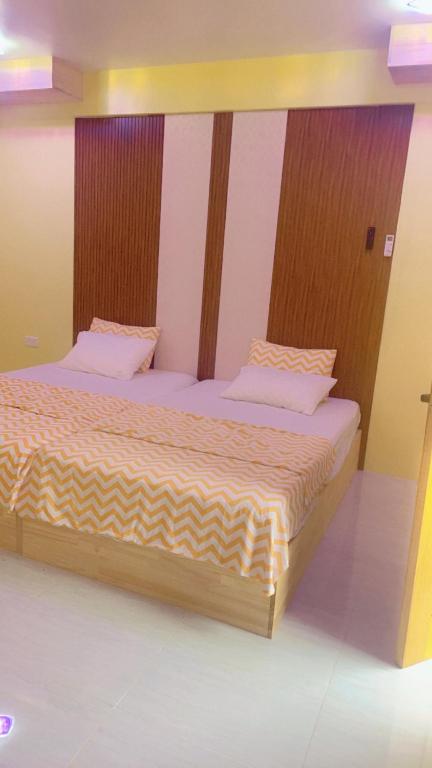 Postel nebo postele na pokoji v ubytování Island life Home Stay