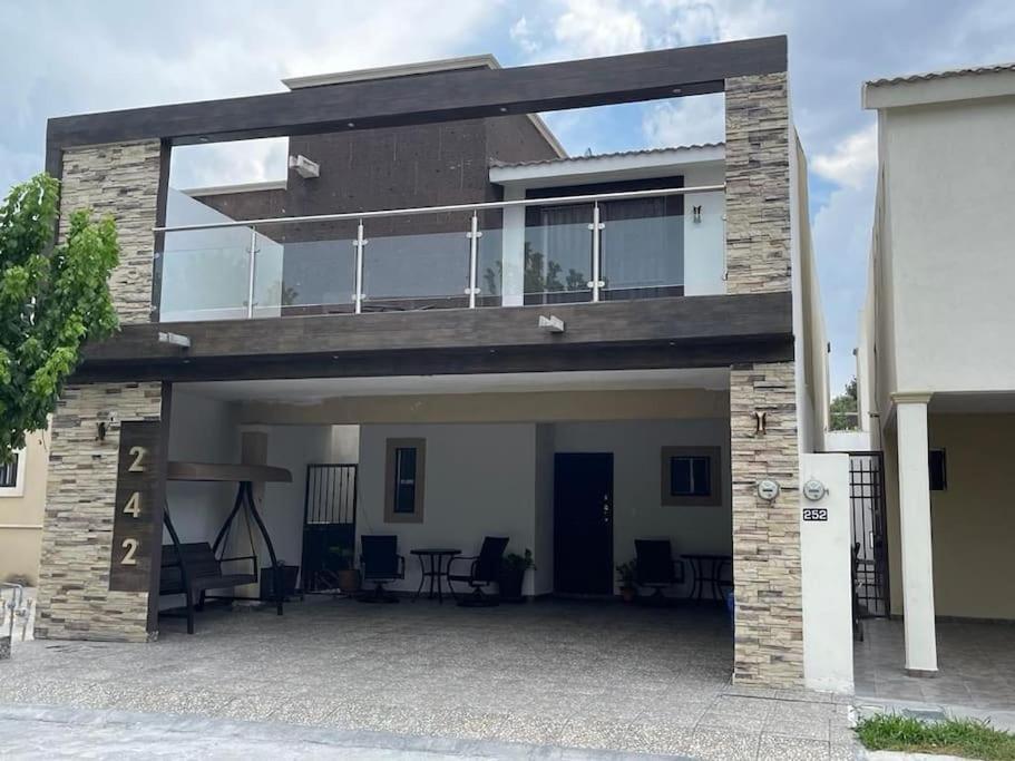 a large house with a balcony on top of it at bonita casa cerca de la Alameda in Saltillo