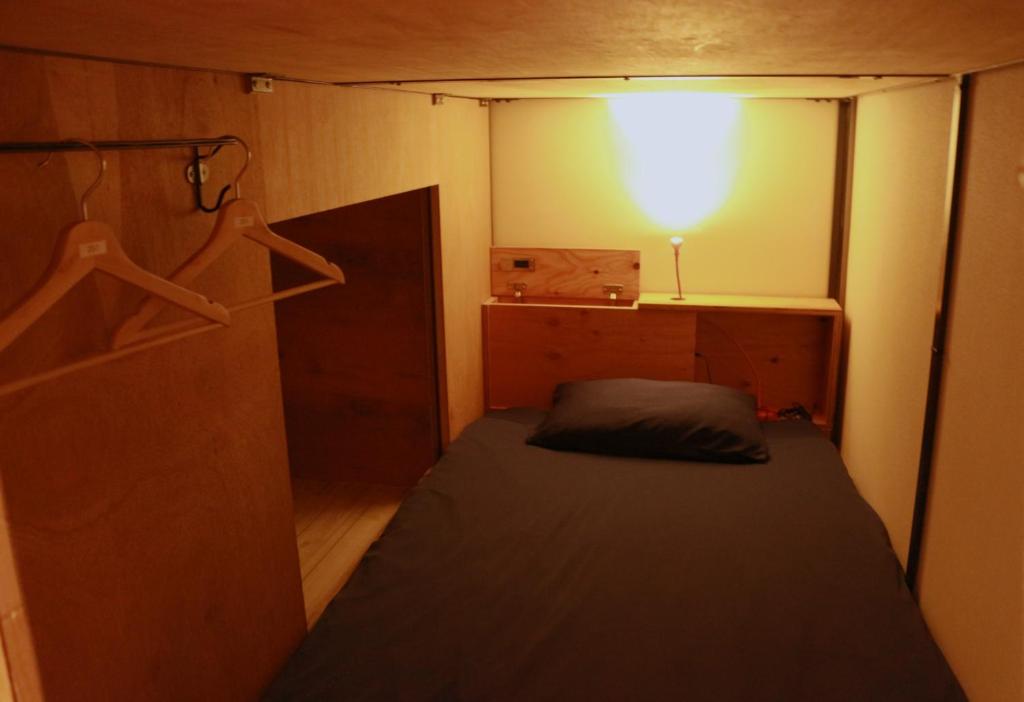 Postel nebo postele na pokoji v ubytování Hostel OSAKA