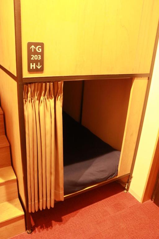 Postel nebo postele na pokoji v ubytování Hostel OSAKA