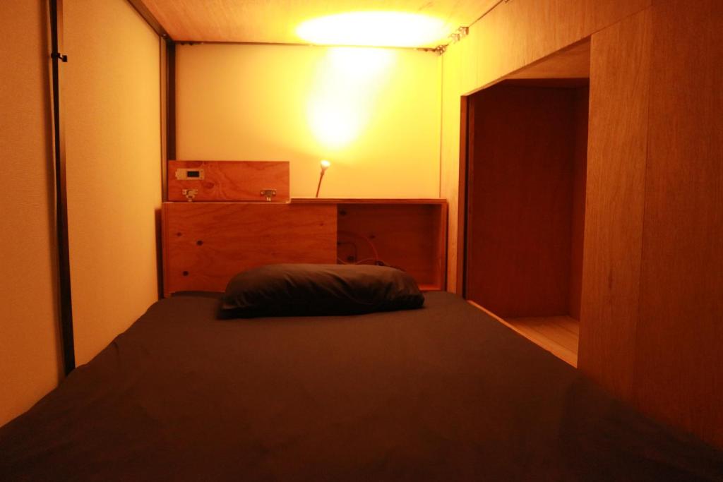 Postel nebo postele na pokoji v ubytování Hostel OSAKA