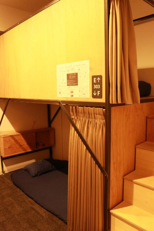 Postel nebo postele na pokoji v ubytování Hostel OSAKA