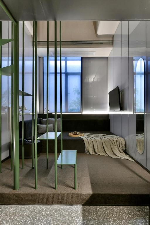 Postel nebo postele na pokoji v ubytování NOA Hotel XIAMEN