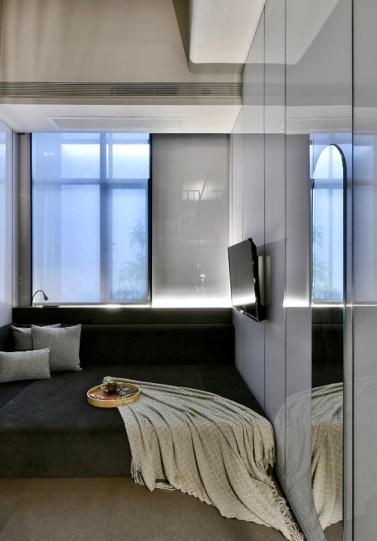 TV a/nebo společenská místnost v ubytování NOA Hotel XIAMEN
