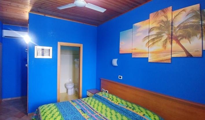 Postel nebo postele na pokoji v ubytování Porto Recanati Zimmer