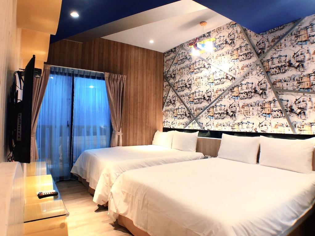 Postel nebo postele na pokoji v ubytování 陽光空氣水海景電梯民宿 Sunshine Air Water Sea View Homestay