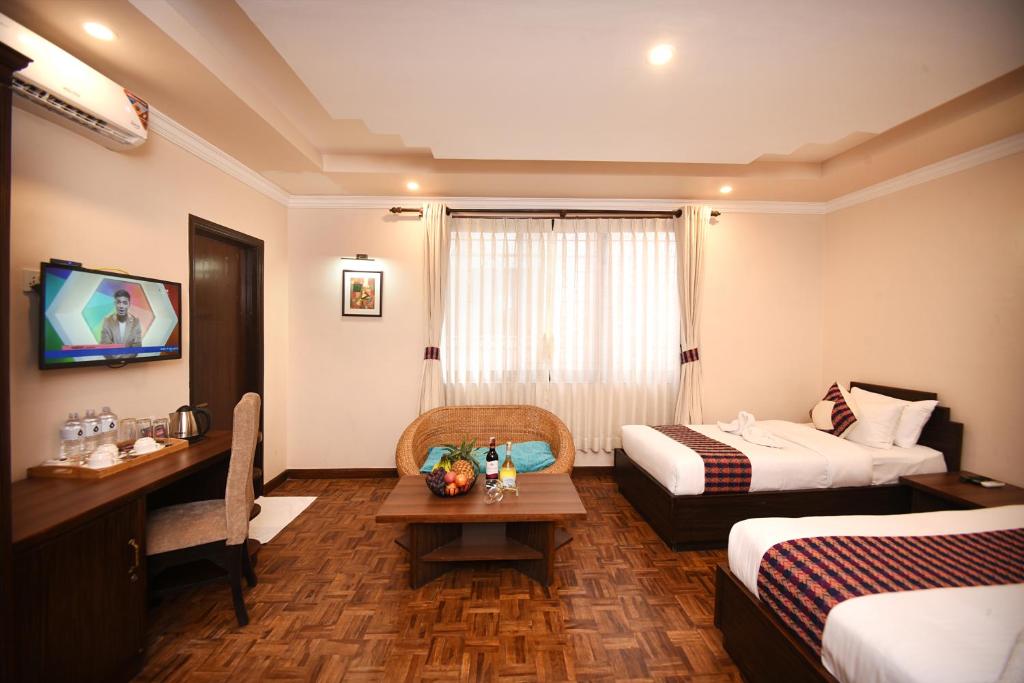Postel nebo postele na pokoji v ubytování Skye Inn Kathmandu