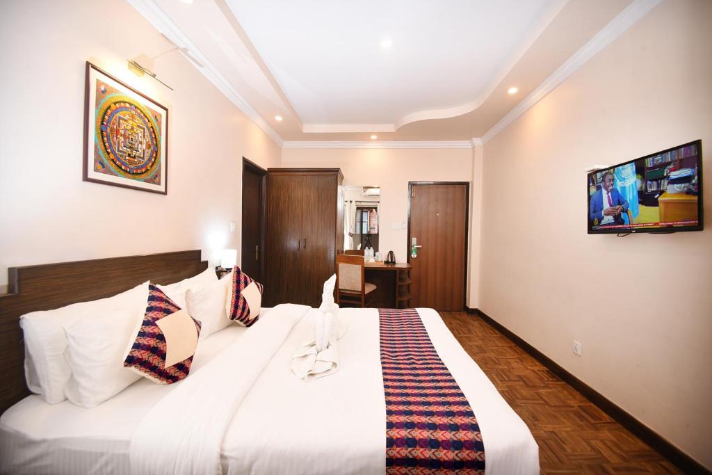 Postel nebo postele na pokoji v ubytování Skye Inn Kathmandu