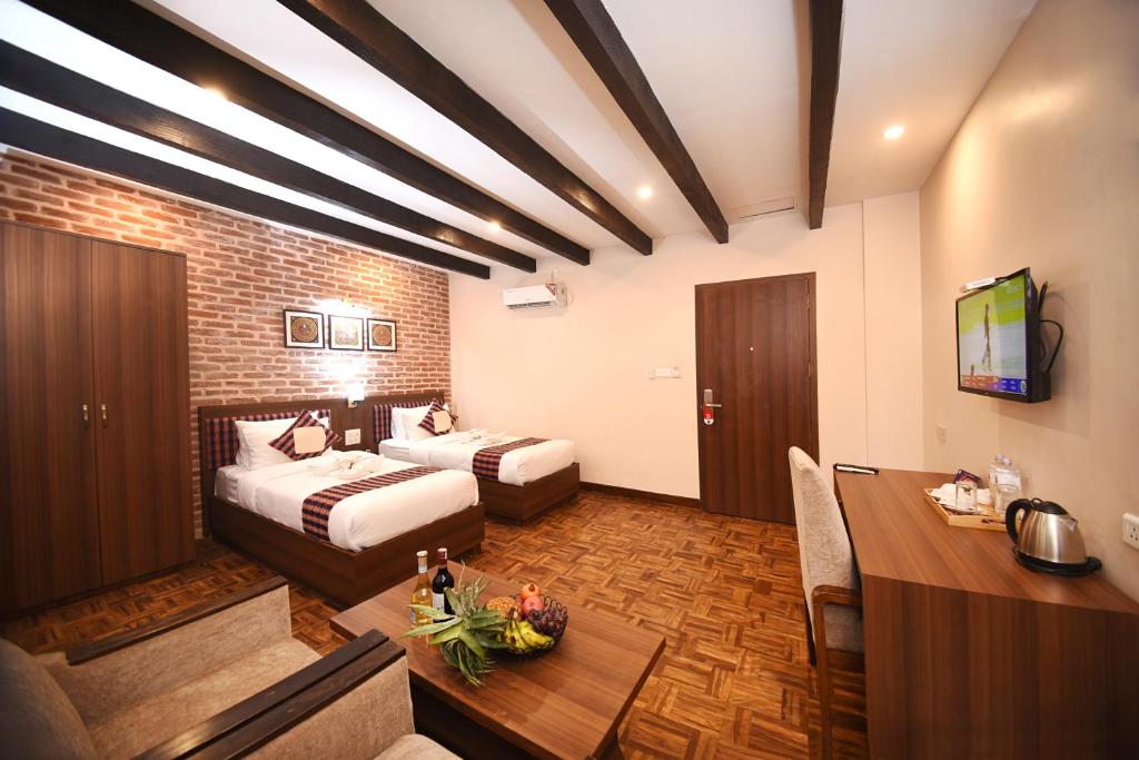 Postel nebo postele na pokoji v ubytování Skye Inn Kathmandu
