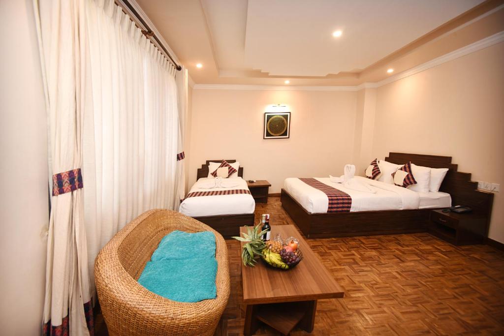Postel nebo postele na pokoji v ubytování Skye Inn Kathmandu