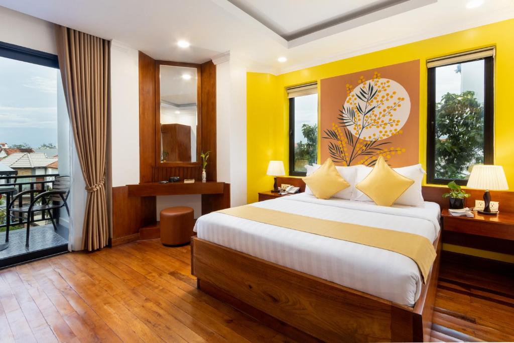 Postel nebo postele na pokoji v ubytování Le Vert Angkor Hotel