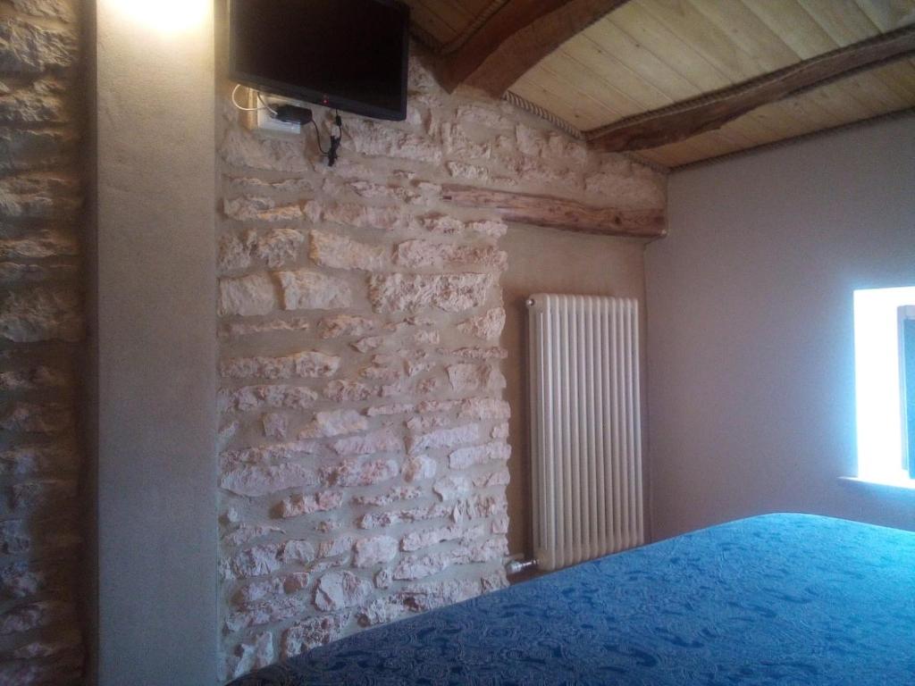 Postel nebo postele na pokoji v ubytování Da Andrea e Raffaella