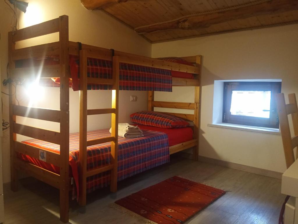 Postel nebo postele na pokoji v ubytování Da Andrea e Raffaella