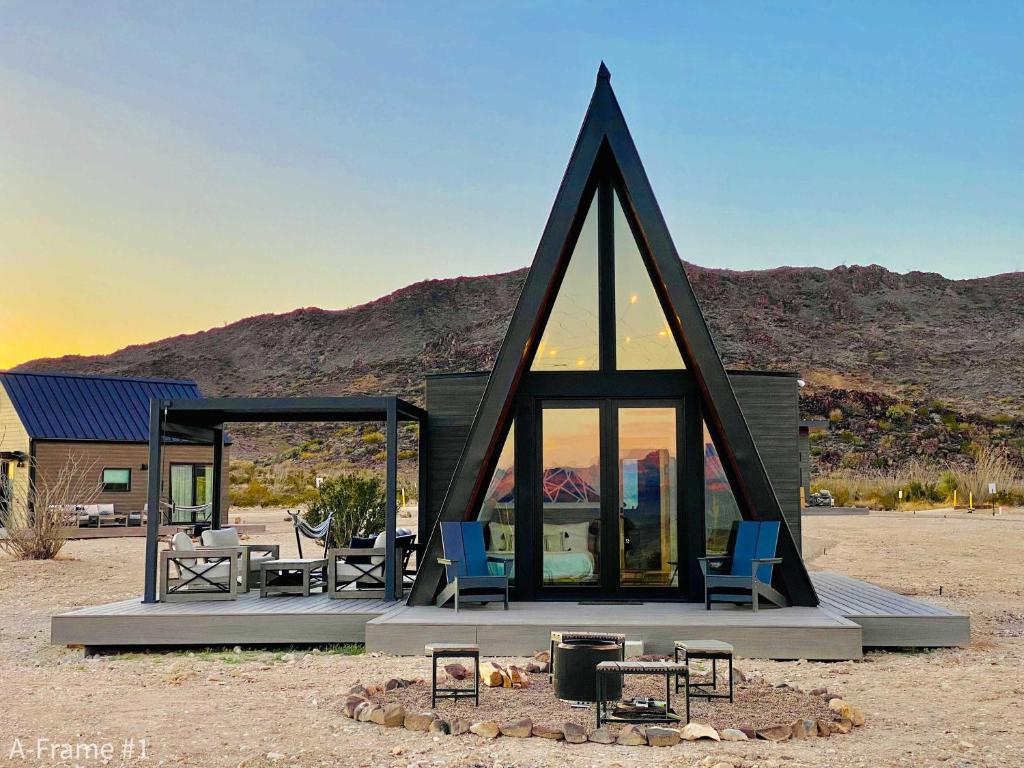 a small house in the middle of a desert at Stardust Big Bend Luxury A-Frame#1 with a fab view in Terlingua