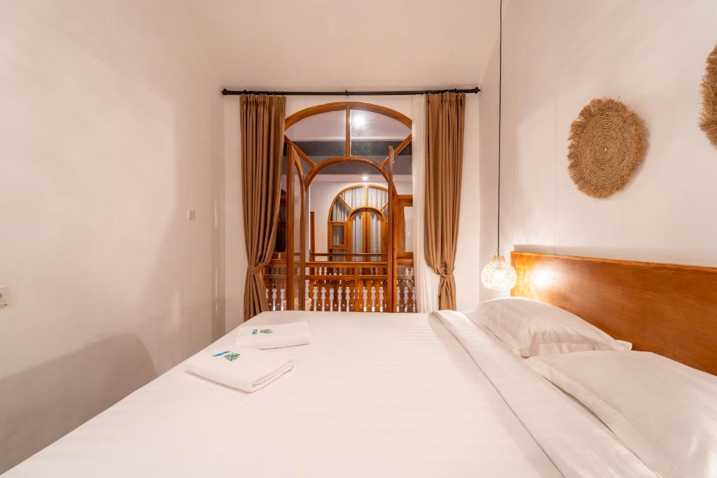 Postel nebo postele na pokoji v ubytování Yulaman Hotel