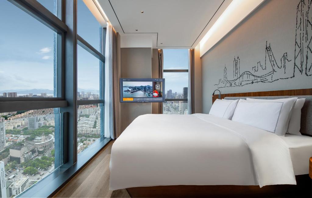 Postel nebo postele na pokoji v ubytování UrCove by Hyatt Shenzhen Bay Nanyou