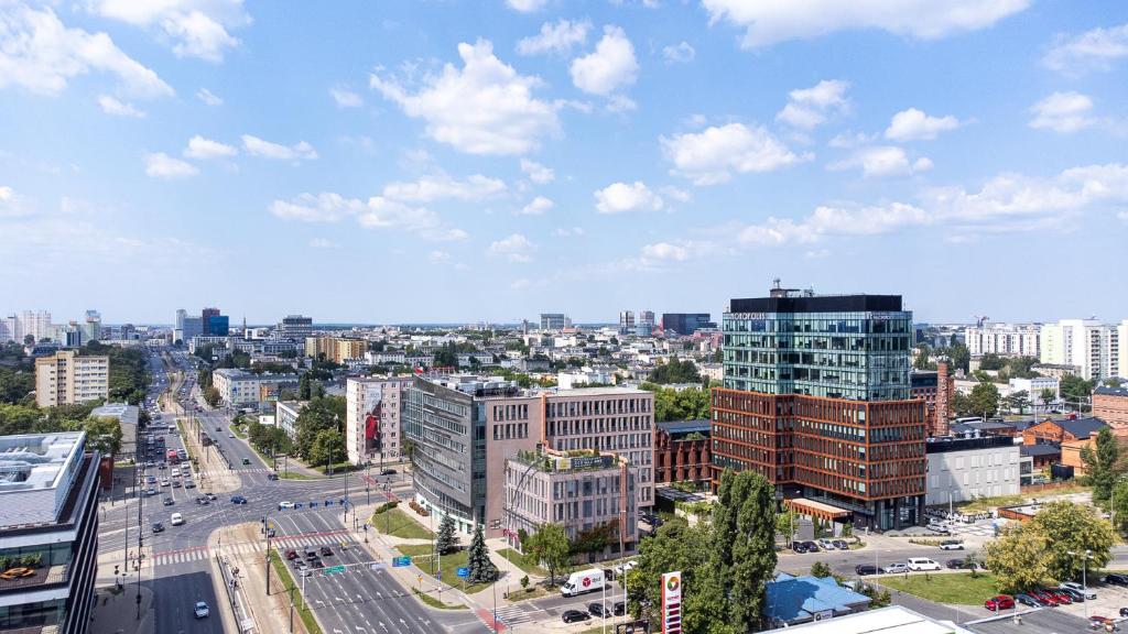 an aerial view of a city with tall buildings at Najtańsze noclegi Piłsudskiego 93 in Łódź