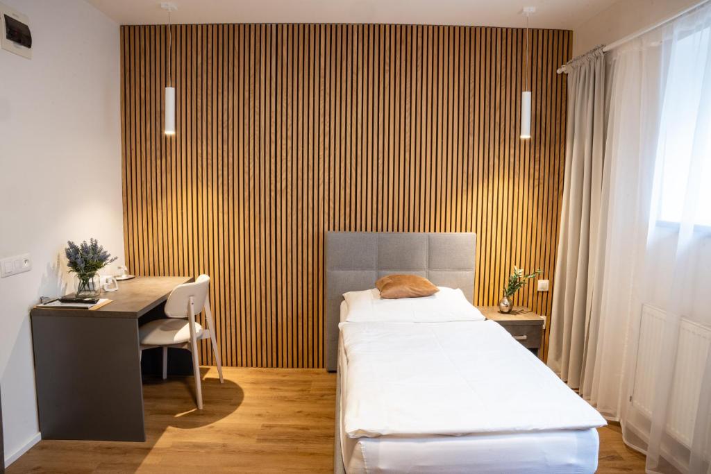 Postel nebo postele na pokoji v ubytování Hotel Sharingham