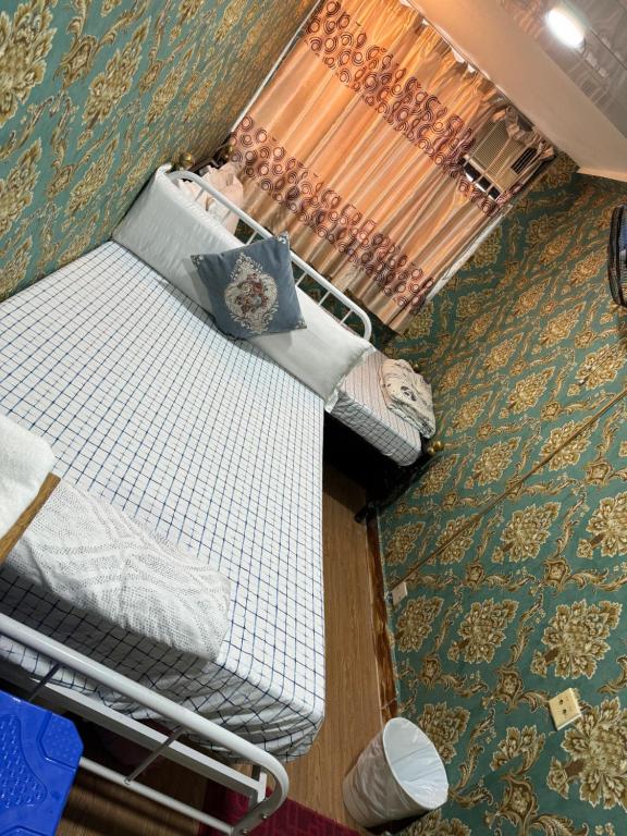 Postel nebo postele na pokoji v ubytování Relianceinternational