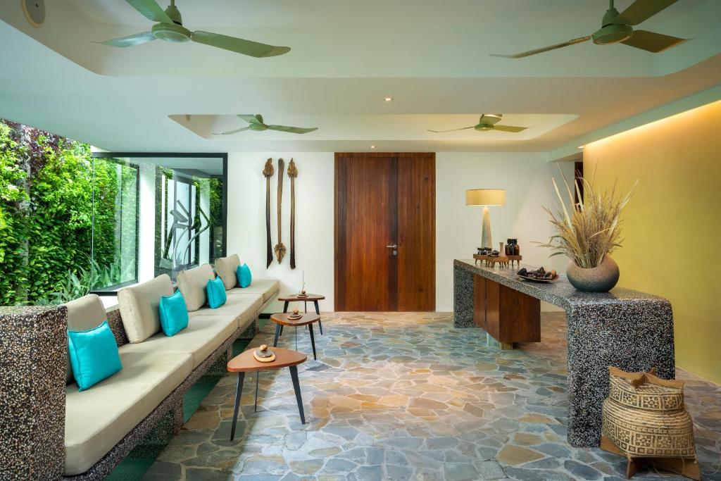 a living room with a couch and a table at Viroth's Hotel in Siem Reap