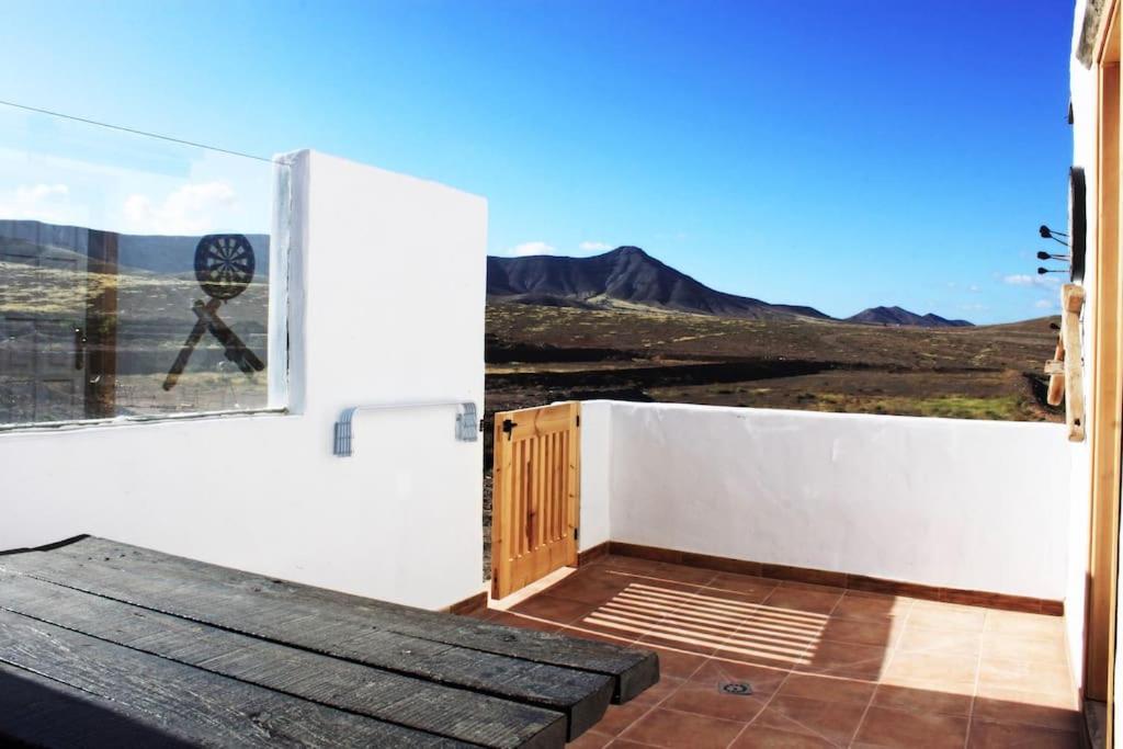 a room with a window with a view of the mountains at La Carpintería nature relax in Tefía