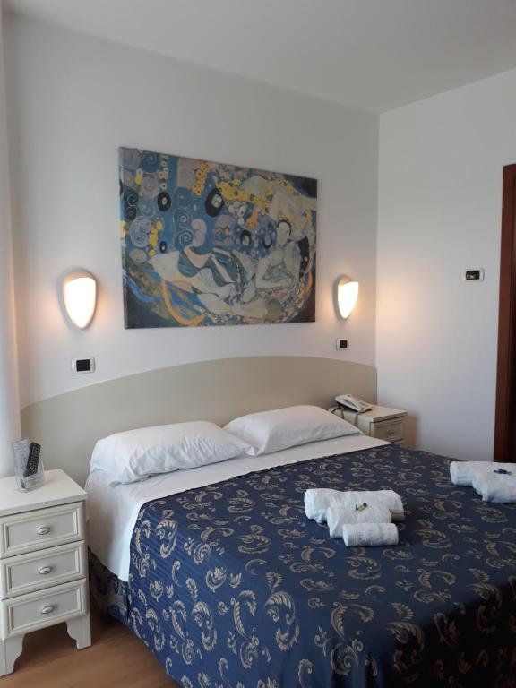 Łóżko lub łóżka w pokoju w obiekcie Hotel La Palazzina