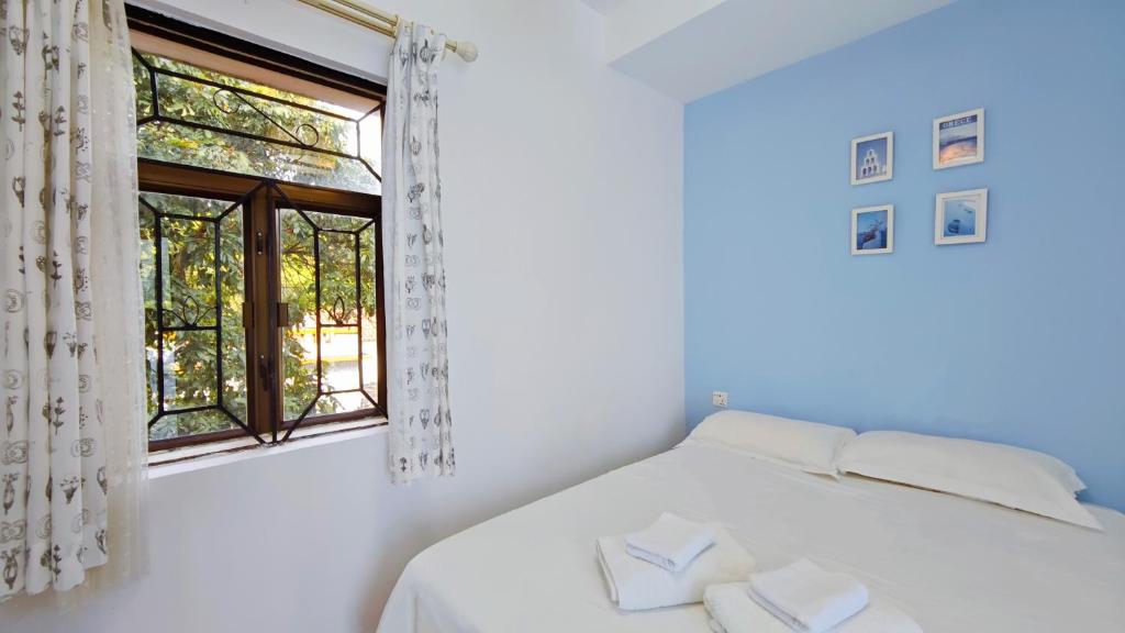 Postel nebo postele na pokoji v ubytování Cloud Tree Inn Boutique Guesthouse XiChong DaPeng ShenZhen 深圳大鹏西涌云树里民宿Yun Shu Li