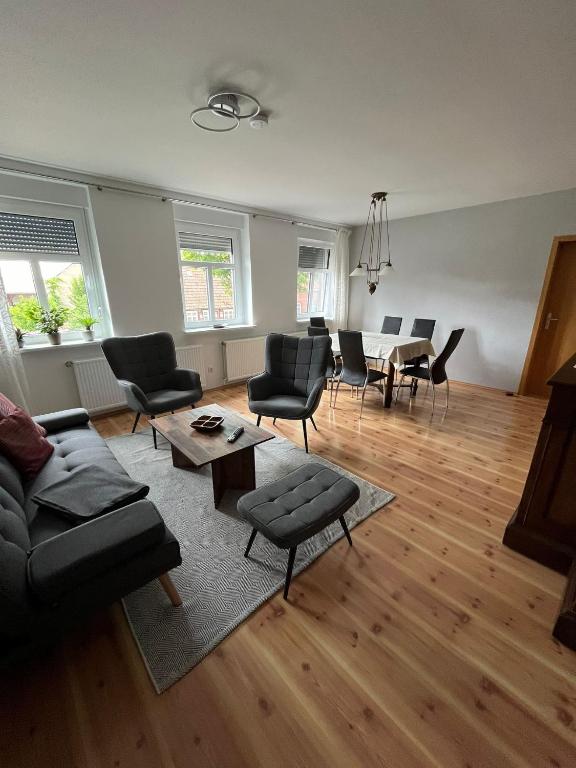 a living room with a couch and chairs and a table at Ferienwohnung Lange in Kalbe