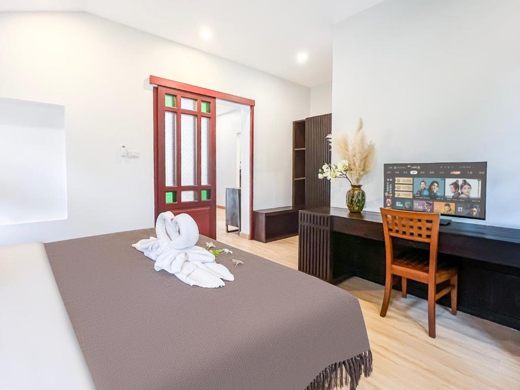 Postel nebo postele na pokoji v ubytování begonia N7 villa resort海棠7号别墅酒店