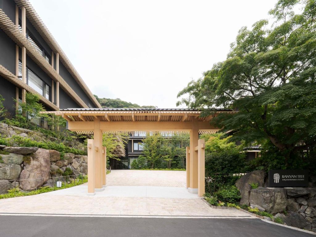 a wooden archway in front of a building at Banyan Tree Higashiyama Kyoto in Kyoto