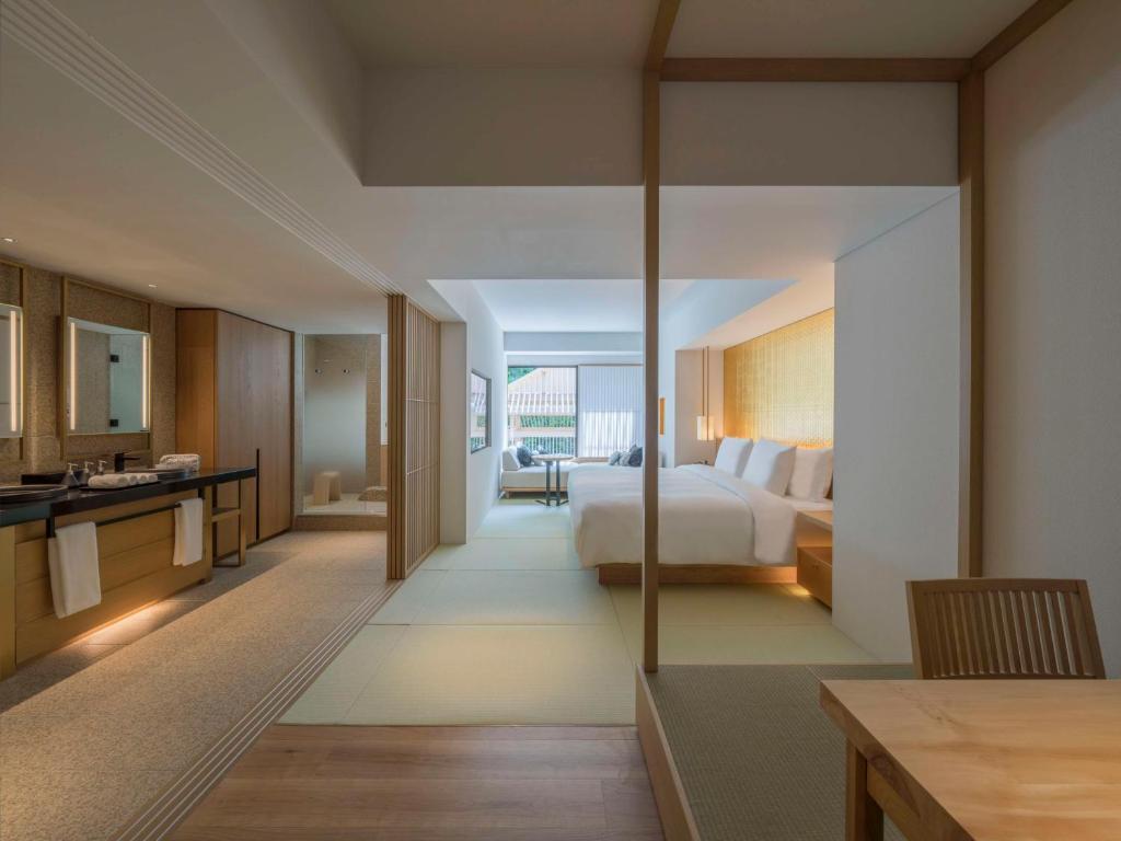 a hotel room with a bed and a bathroom at Banyan Tree Higashiyama Kyoto in Kyoto