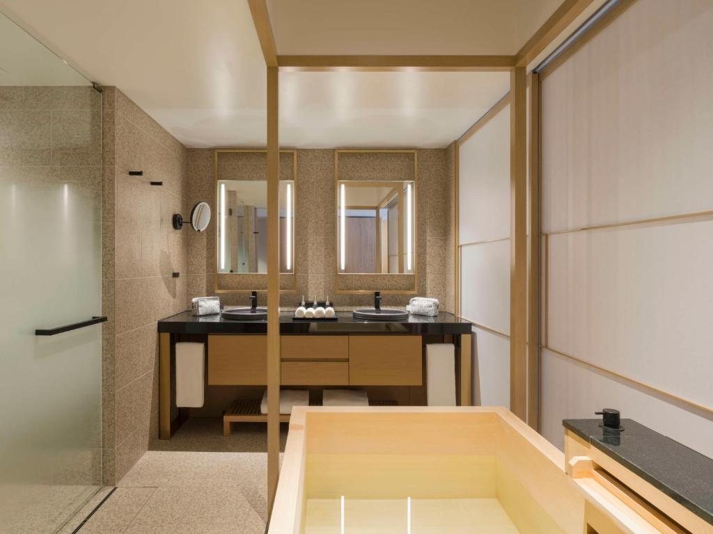 a bathroom with a sink and a mirror at Banyan Tree Higashiyama Kyoto in Kyoto