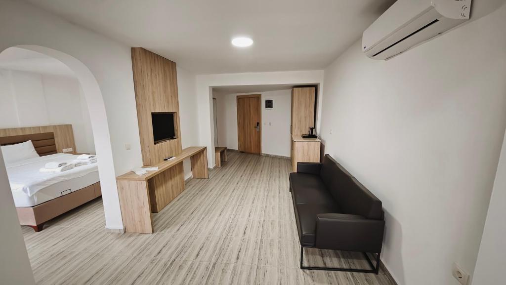 Кровать или кровати в номере Aremsis Holiday Resort