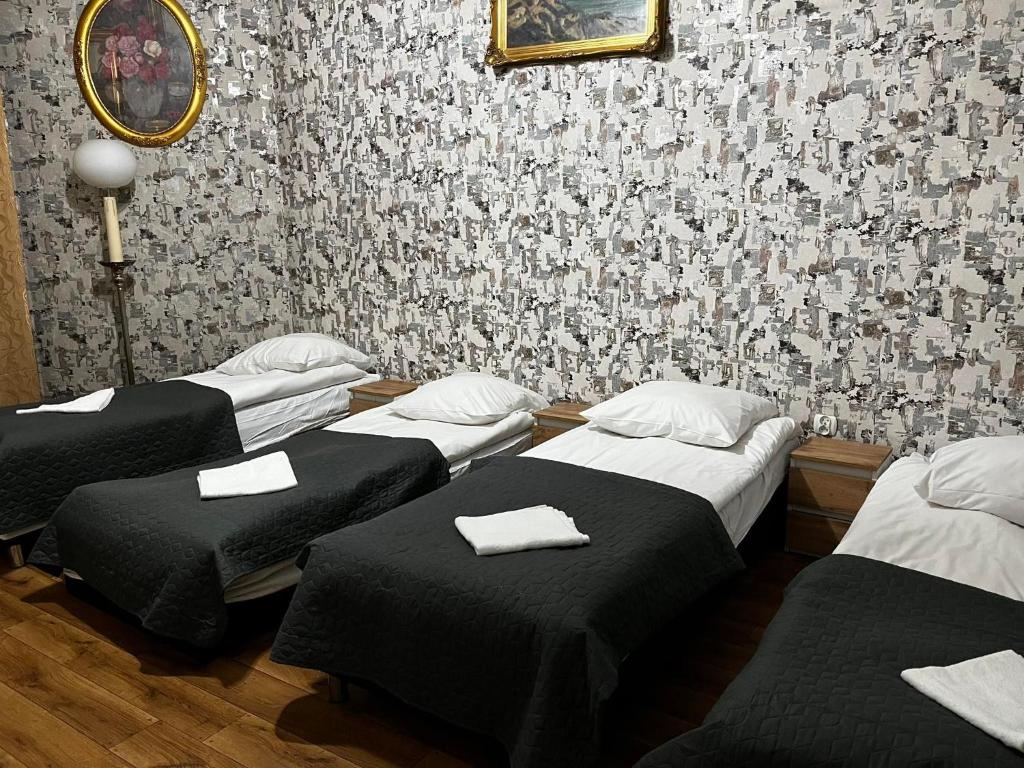 Posteľ alebo postele v izbe v ubytovaní Metropolitan Apartments