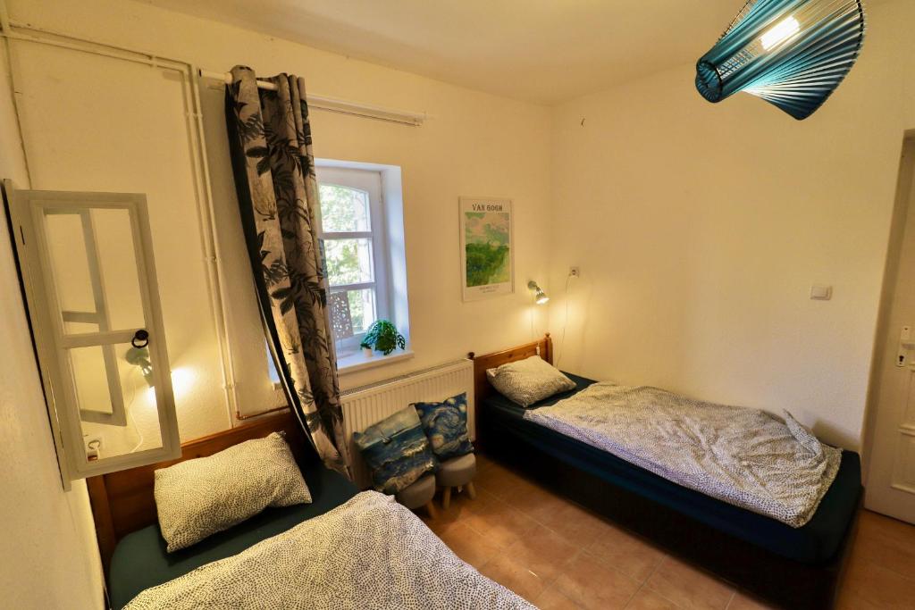Postel nebo postele na pokoji v ubytování Palócliget Vendégház