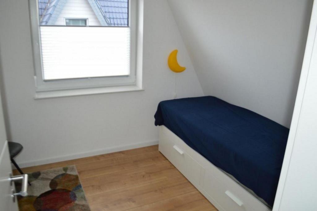 Postel nebo postele na pokoji v ubytování Ferienhaus Tim Paul