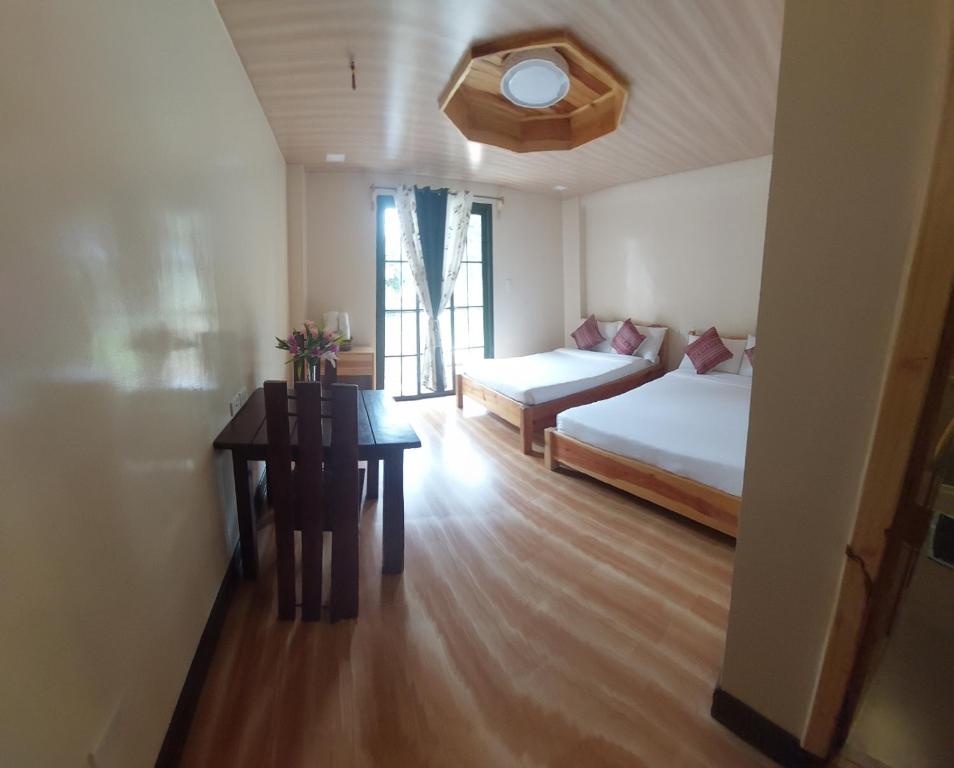 Postel nebo postele na pokoji v ubytování Quarry Bay Hometel Sagada