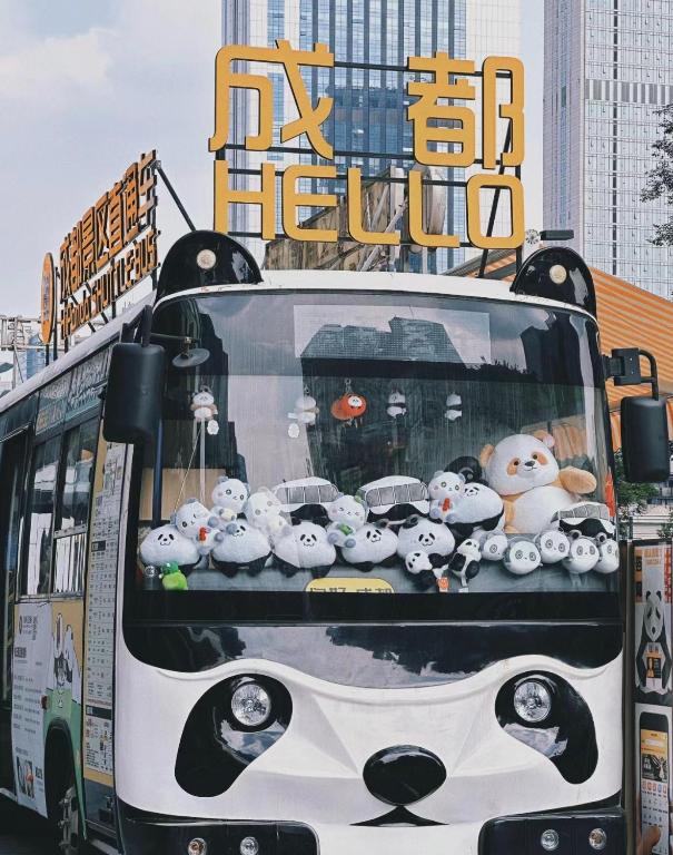 a bus with a bunch of hello kitty decorations on it at Nost algia S Hotel Near Chengdu Kuanzhai Alley - People's Park, Chengdu Panda Base, 10 minutes walk to subway , Free laundry, English communication well, Free coffee,Free travel advice in Chengdu