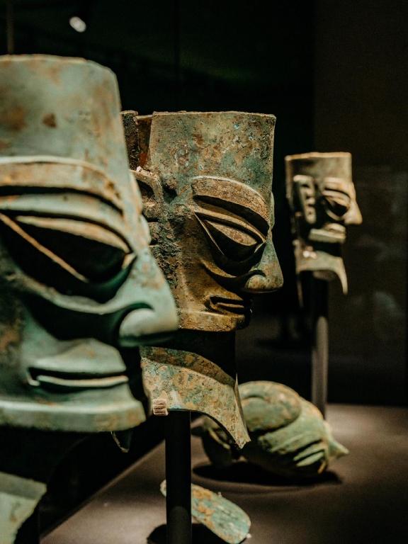 a group of artifacts on display in a museum at Nost algia S Hotel Near Chengdu Kuanzhai Alley - People's Park, Chengdu Panda Base, 10 minutes walk to subway , Free laundry, English communication well, Free coffee,Free travel advice in Chengdu