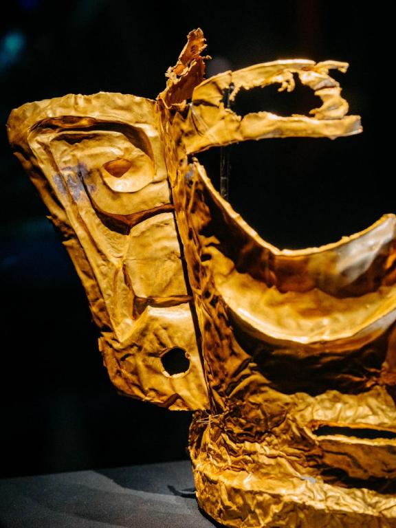 a close up of a gold object on display at Nost algia S Hotel Near Chengdu Kuanzhai Alley - People's Park, Chengdu Panda Base, 10 minutes walk to subway , Free laundry, English communication well, Free coffee,Free travel advice in Chengdu