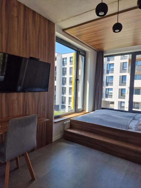 Postel nebo postele na pokoji v ubytování Legnicka Business Apartments