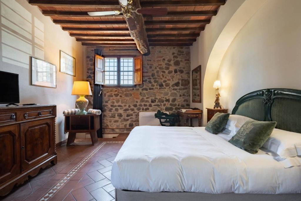 Postel nebo postele na pokoji v ubytování Villa La Selva Wine Resort