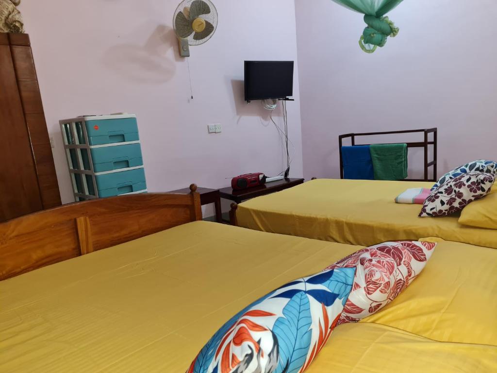 Postel nebo postele na pokoji v ubytování Ama HomeStay Guest Colombo