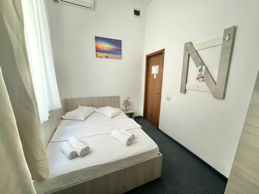 Postel nebo postele na pokoji v ubytování Neptun Resort