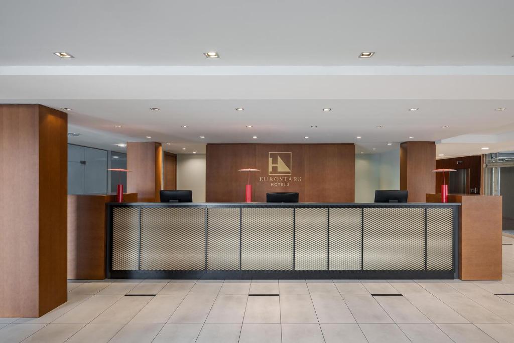 a lobby of a hotel with a reception desk at Eurostars Queen of Montenegro in Budva