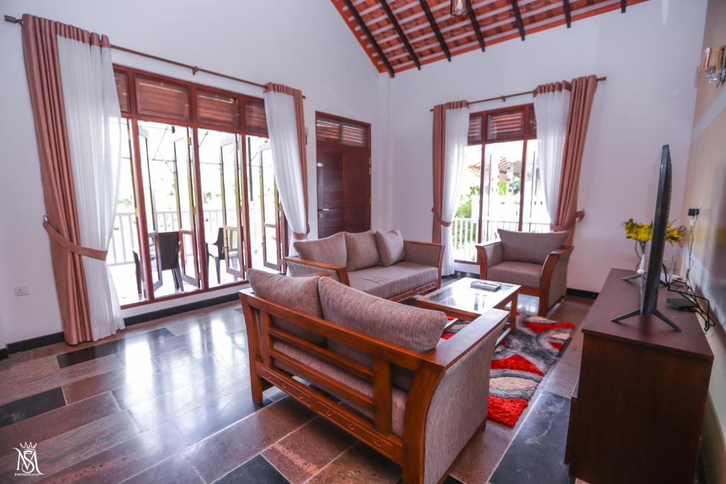Posezení v ubytování Rivershore Villas